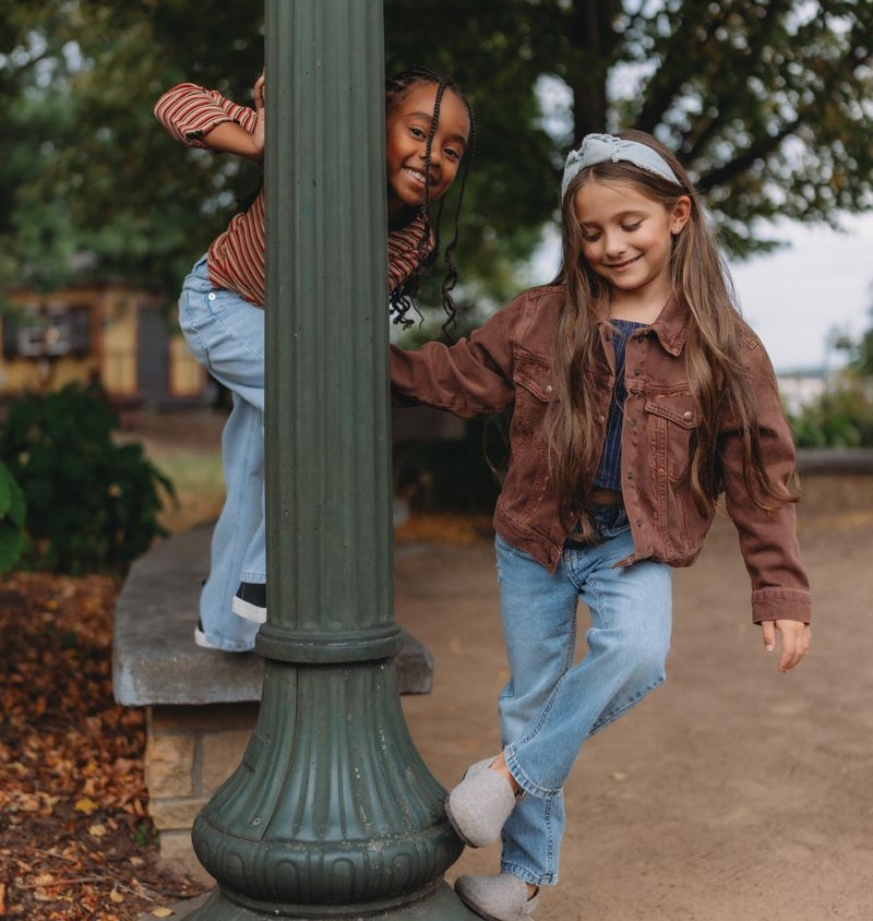 2 girls posing by lamp post